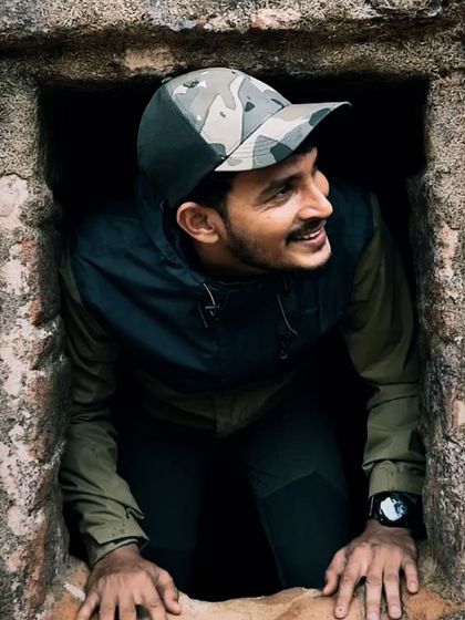 Exploring the unique star-shaped Manjarabad Fort in Sakleshpura. I'm peeking out from one of the lookout points built into the fort's walls.
