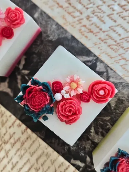 These Regal Pillar Candles are more than just for illumination; they are masterpieces. This one is topped with intricate floral wax designs, transforming any space into a symphony of elegance.
