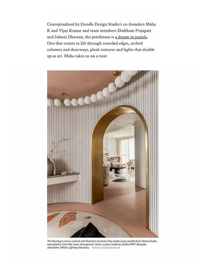 The entrance lobby of the "Marshmallow" penthouse, as featured in Architectural Digest, with its bespoke lights and brass-lined arch.
