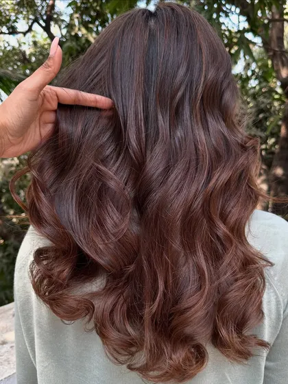 This is my 'Chocolate Pecan Dream' creation. We started with a faded base and gave her this incredibly rich, warm brown with delicate pecan highlights. The result is a glossy, healthy-looking color that’s perfect for any season.