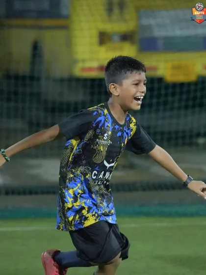 The pure joy of football. A young player celebrates after successfully completing a drill, embodying the fun and positive energy of our training sessions.