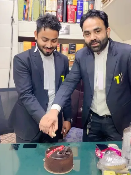 Cutting the cake with my mentor to mark the occasion. His guidance has been instrumental in my career.