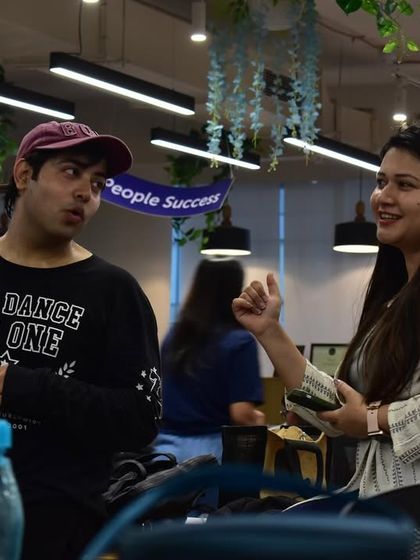 A moment of interaction during a corporate wellness session. It's about connecting through dance.