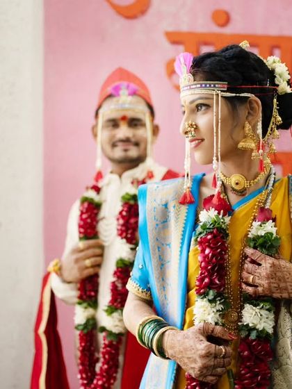 A creative portrait using the groom in the background to frame the beautiful bride in the foreground.