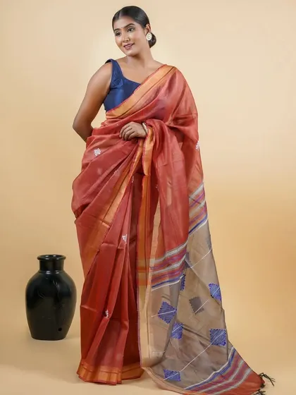 This lightweight linen-blend saree is perfect for daytime events. It's a ready-to-wear piece that combines the breezy comfort of linen with the convenience of a pre-stitched design.