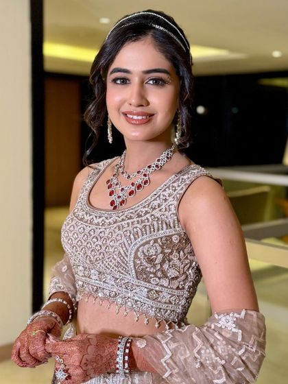 For Serena’s sangeet, we kept it fresh yet defined with soft smokey eyes, glowing skin, and muted rosy lips.