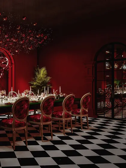 A view of the dining area looking towards the bar, showing the cohesive yet distinct zones within the space.