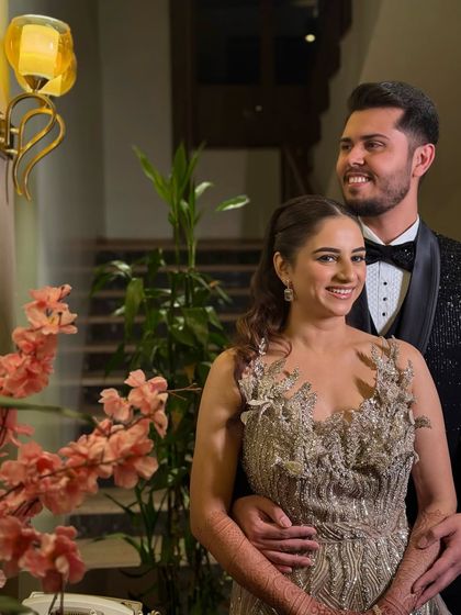 The happy couple, ready for their reception. The bride's makeup is flawless and long-lasting, ensuring she looks perfect all night.