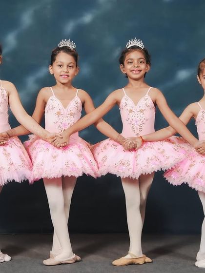 Our youngest ballerinas dressed for their 'Barbie x Swan Lake' performance. With their tiaras and pink tutus, they are ready to bring a touch of fairytale magic to the stage.