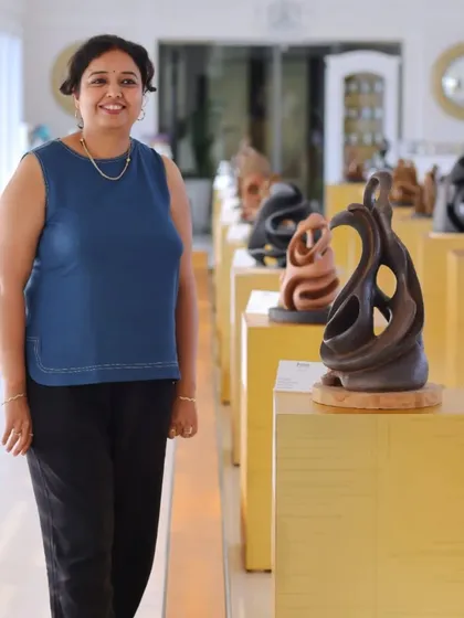 Artist Aarti Bhadauria stands proudly with her collection of terracotta sculptures. We are dedicated to showcasing artists who master unique mediums, bringing diverse forms of expression like these earthy, emotive sculptures to our audience.