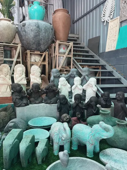 A gathering of some of our most charming pieces. This shot shows our collection of 'lucu' monks in various poses, alongside stone elephants and other whimsical artifacts.