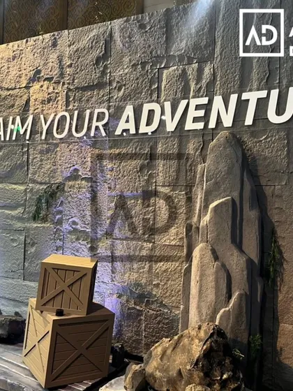 This large-scale wall for an event or commercial space is clad in PU stone panels. It provides a powerful, adventurous backdrop that looks and feels like a real rock face.