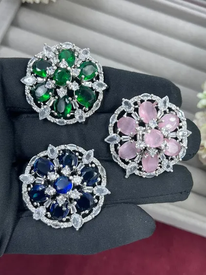 Our adjustable cocktail rings are a fast-moving item for any retailer. This video shows the variety of vibrant colors available, from ruby red to sapphire blue, all set in a floral AD Zircon design.