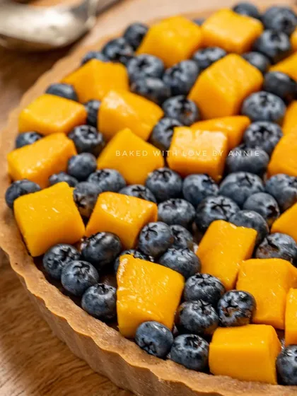 My Signature Chocolate Pudding Tart gets a seasonal twist with fresh mangoes and blueberries. The rich chocolate pairs beautifully with the sweet and tart fruits.