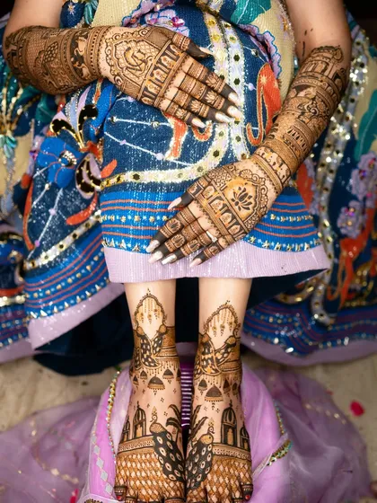 Bridal mehendi isn't complete without adorning the feet. This design features majestic peacocks and architectural domes, ensuring the bride is decorated with beautiful art from her hands to her feet.