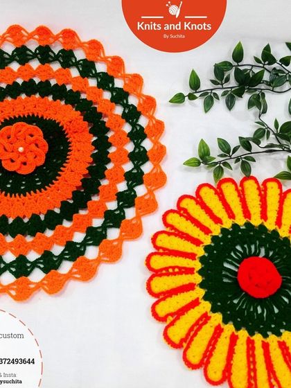 Two dispatched doilies, one in a sunflower pattern and the other in a geometric orange and green design. I love creating custom pieces for my clients.