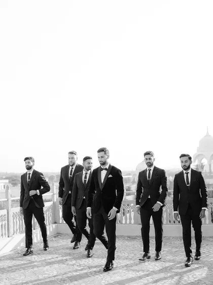 The groom and his groomsmen, looking sharp and ready for the wedding. This black and white shot captures the cool confidence and camaraderie of the groom's crew.