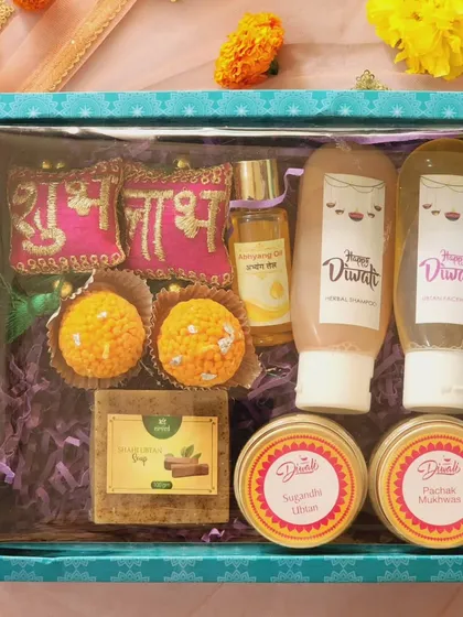 For those looking for a grand gesture, I curate these comprehensive Diwali hampers. This one is filled with a complete set of my Ayurvedic bath and body products, mithai candles, and other festive treats, all presented in a beautiful gift box.