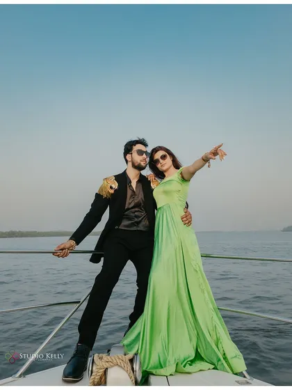 Adventure and glamour meet on the open sea in Goa. This shot captures a fun, dynamic moment on a private yacht, showcasing how I blend high-fashion poses with the beautiful coastal scenery for a unique pre-wedding shoot.