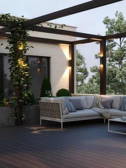 We design serene rooftop terraces that become your private escape, complete with a comfortable sectional sofa, lush greenery, and ambient lighting for perfect evenings.