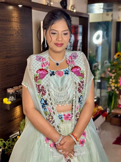 Soft, subtle, and stunning. This beautiful guest is wearing a pastel outfit with intricate floral embroidery, paired with a clean and elegant makeup look.
