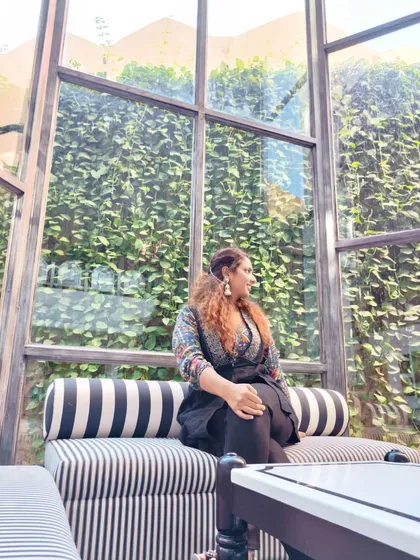 Enjoying the beautiful interiors of a resort in Udaipur. My outfit, with its printed top and black jacket, is a mix of traditional patterns and modern comfort, perfect for a stylish getaway.