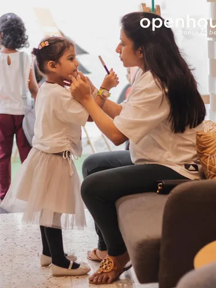 A quiet moment of connection between a mother and child before a session begins. These are the small, precious interactions that build a foundation of security and love.