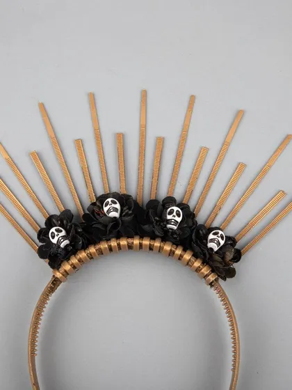A close-up of the skull details on the sunburst headband.