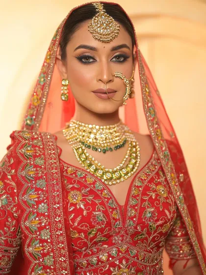A classic bridal portrait. The makeup is strong and defined, perfectly suited for a bride who wants to make a royal statement.