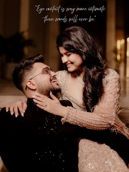A candid and joyful moment captured during an indoor shoot. The genuine smiles and eye contact show the deep friendship and love the couple shares, making for a heartwarming portrait.
