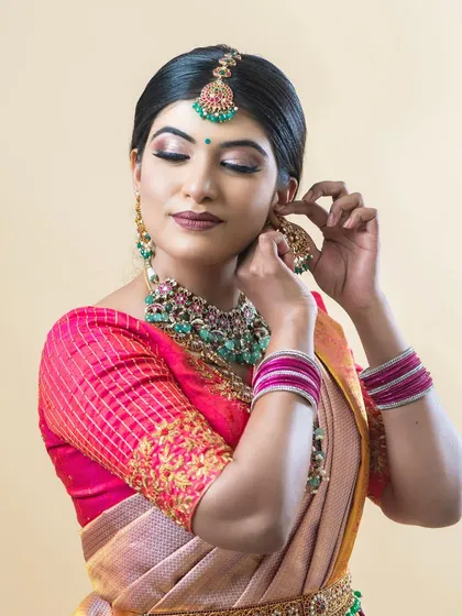 A stunning portrait of Pinky, with makeup featuring a sharp wing, beautiful eyeshadow, and perfectly placed jewellery.