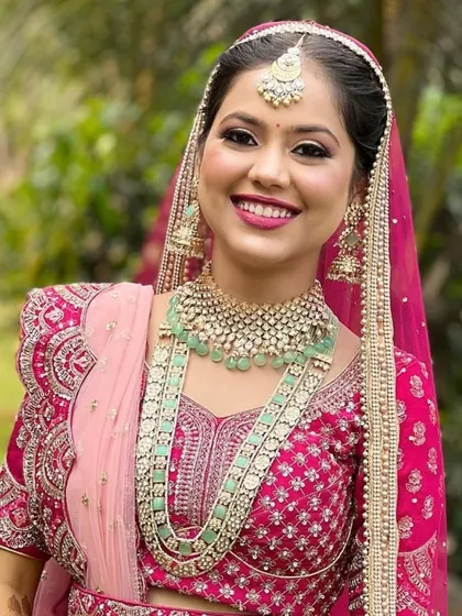 A smiling bride is the best accessory. Here is one of my happy clients looking radiant in a pastel green layered necklace set, paired beautifully with her pink embroidered lehenga.