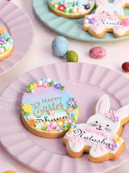 A set of my personalized Easter cookies, hand-decorated with pastel colors, floral details, and custom names. These are a wonderful, personal touch for place settings or as a special gift.