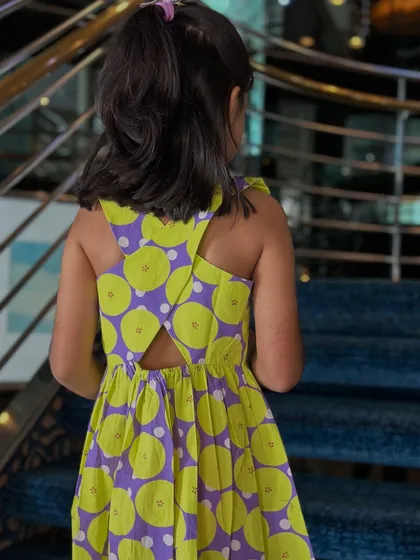 When comfort meets cuteness, you get a wardrobe win. This vibrant lime and purple dress is made for real moments, with no fussy buttons or scratchy fabric.