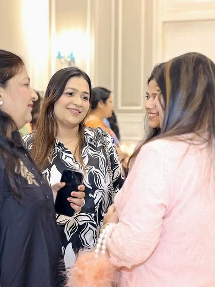 Women enjoying a conversation at my 'Mom & Me' event. My goal is to create spaces and events where guests can connect, share stories, and enjoy each other's company in a comfortable and elegant setting.