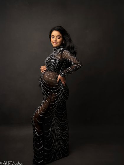 This sheer, embellished gown is for the mama who wants a truly glamorous and dramatic studio maternity shoot. It’s a statement piece that photographs like a dream.