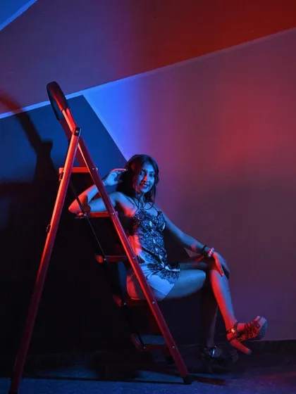A playful smile in the midst of the moody lighting. This shot shows the fun side of my personality.