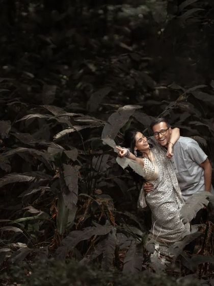 A fun and energetic moment captured in the woods. We love it when couples let loose and show their playful side during their pre-wedding session.