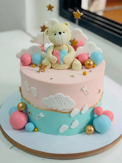 The sweetest secret is wrapped in clouds and stars. This gender reveal cake features a teddy bear holding a heart, with a "Boy or Girl?" theme perfect for a special announcement.