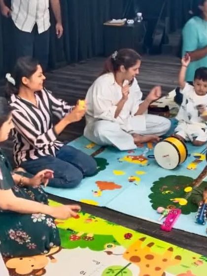 A close-up look at instrument exploration time. Children get to touch and play with different instruments, which is fantastic for their sensory development and fine motor skills.