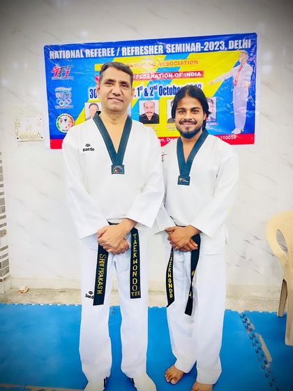 With a National Referee Examiner at a seminar. Continuous learning is key to being a good coach.