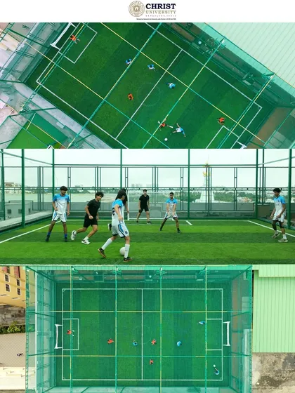 An aerial view of a rooftop football turf at Christ University, demonstrating our ability to capture unique urban campus features and student activities.