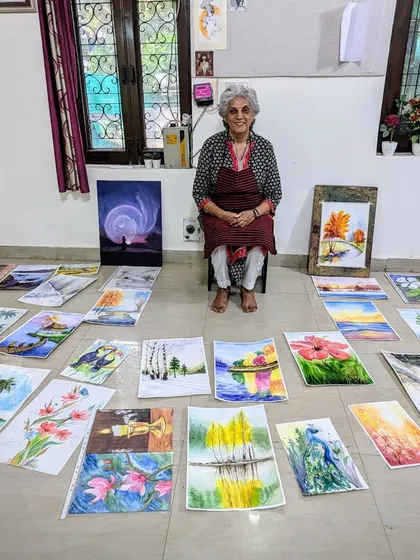 Surrounded by her art, Harinder ma'am is a testament to what dedication and passion can achieve. Here she is with her collection of beautiful watercolor landscapes.