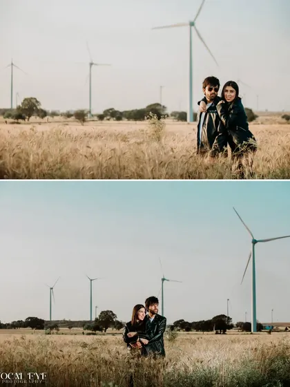 A couple's portrait session in a wheat field with windmills in the background. The edgy leather jackets contrast with the rustic setting for a cool, modern pre-wedding look.