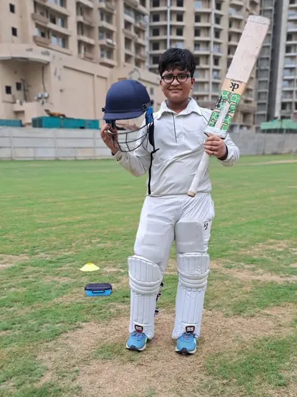 Amay, another key player from the victorious Tigers team, posing with his bat after a significant contribution. Teamwork is about every player doing their part.