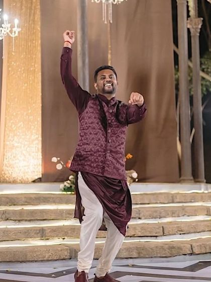 The groom rocks the stage with his solo act. It's not just the brides who get to be in the spotlight.