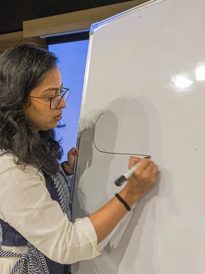 A participant at a workshop, focused on her creative task.