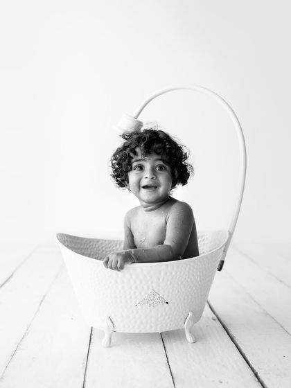 Another adorable black and white photo from the tub. Look at that charming smile and those amazing curls!