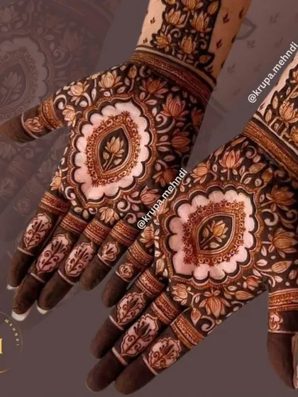 A beautiful lotus-centric design. The lotus is a symbol of purity and beauty, and it makes for such an elegant mehndi motif.
