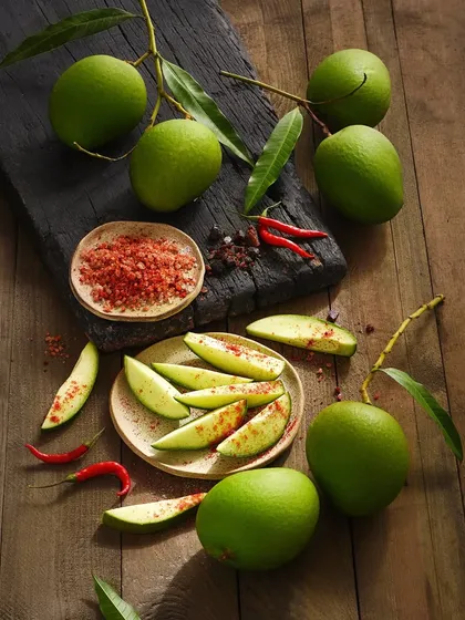 This image brings back so many memories. My goal with this food styling was to create a sensory experience, highlighting the contrast between the tart green mango and the spicy red masala. It’s a great example of telling a story with food.
